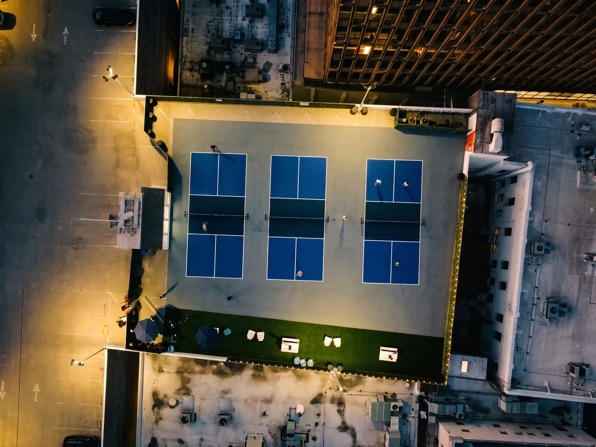 Members playing on the rooftop pickleball courts above Downtown Berkeley.