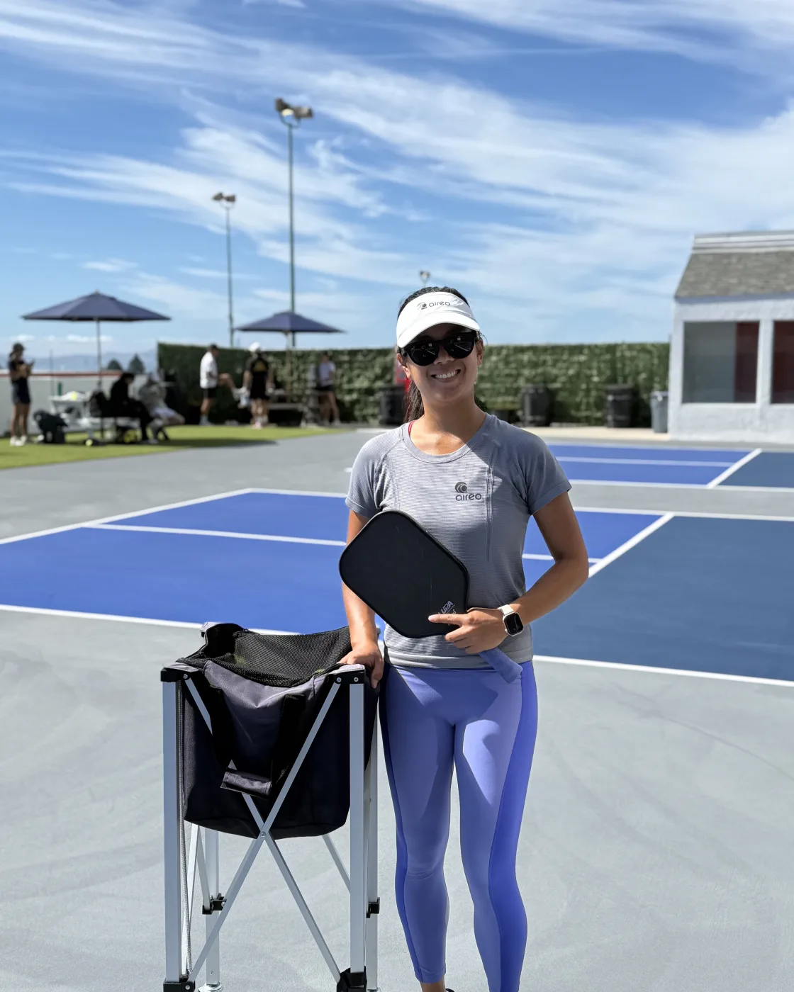 Naomi Tran on the rooftop courts, paddle in hand
